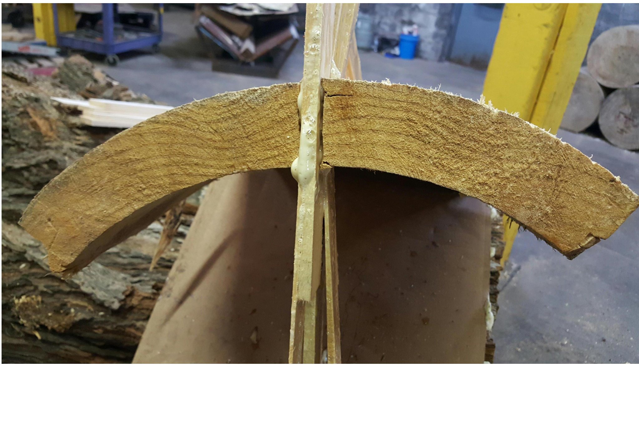 Expanding polyurethane foam injected into the crack from the outside — foam bead visible along the full length of the crack, cardboard backing visible inside